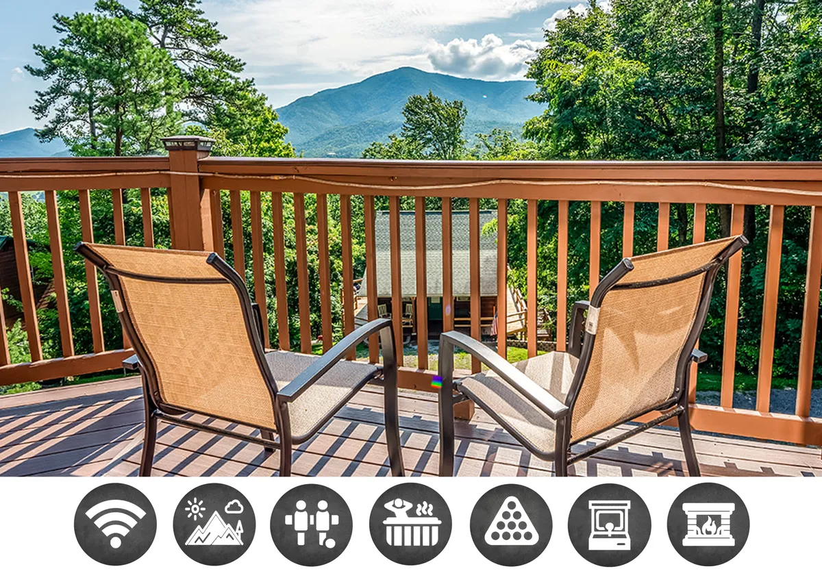 The image shows a cozy deck with inviting chairs where guests can relax, framed by a rustic wooden railing. Beyond the deck, stunning panoramic views of the Smoky Mountains stretch out, creating an idyllic backdrop for sunrise coffee or stargazing under the clear Tennessee sky.